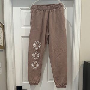 Boys Lie Brown Jogger sweatpants with White Graphic and pockets.